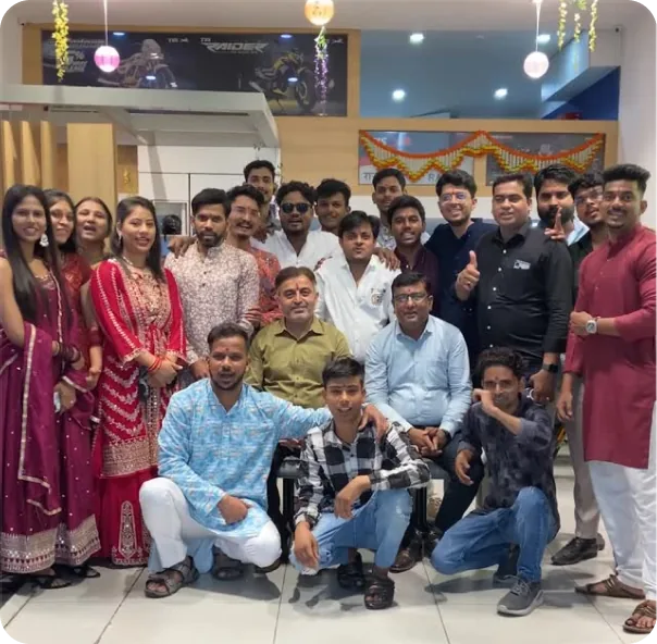 RAJ TVS showroom team celebrating together