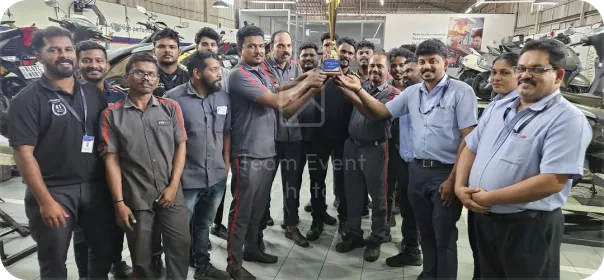 RAJ TVS workshop team with trophy